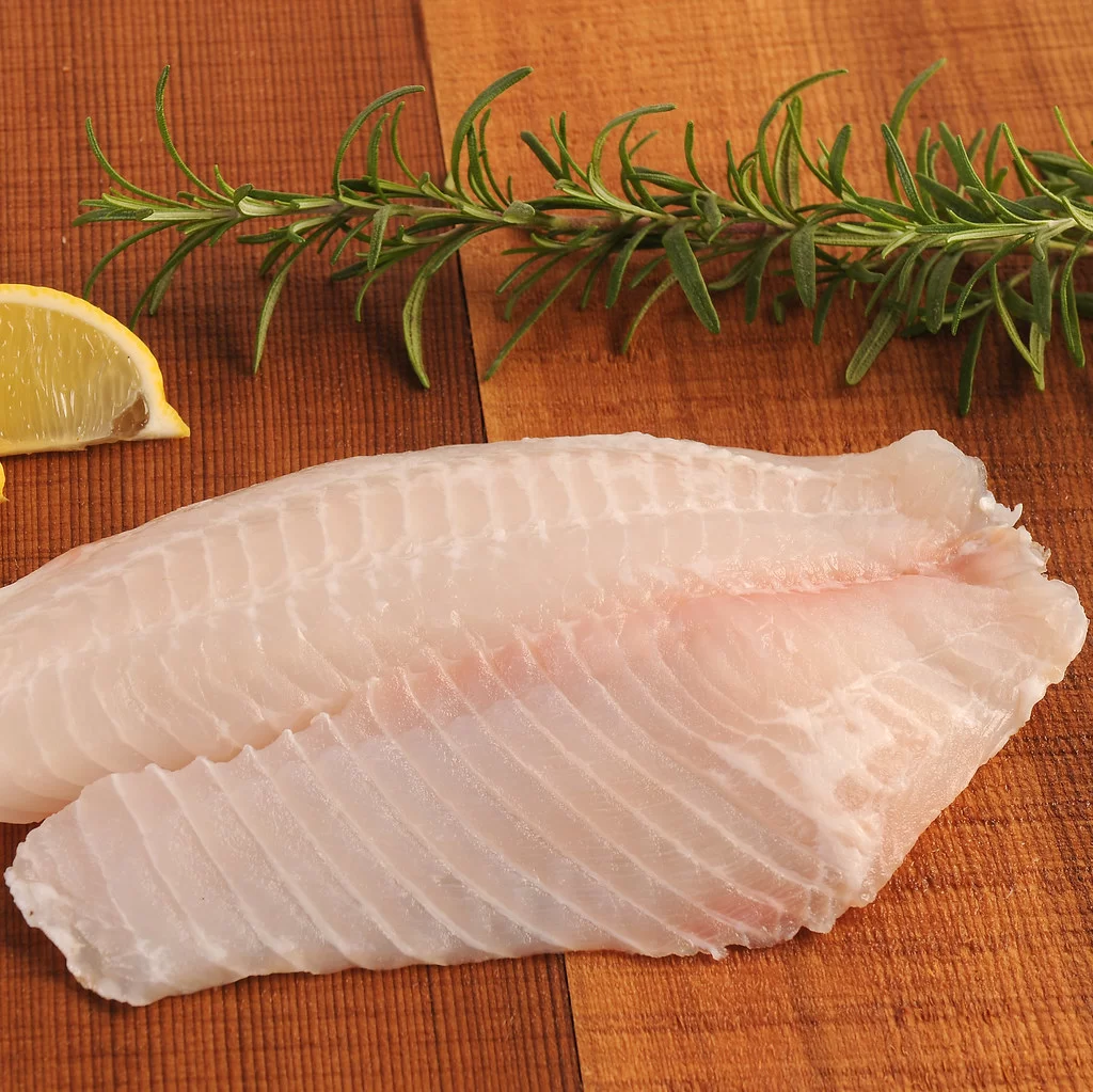 Vacuum-sealed white Nile Perch fillet being weighed for chilled export quality control.